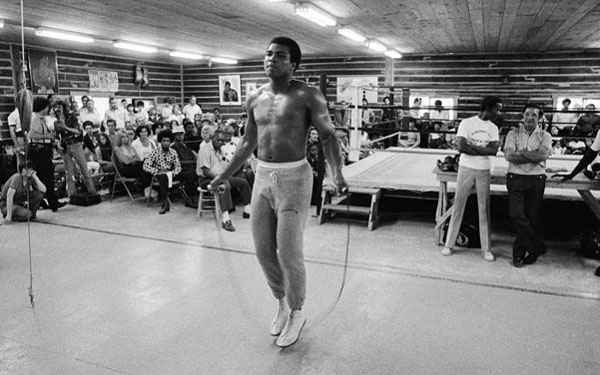 Muhammad Ali training in a boxing ring.