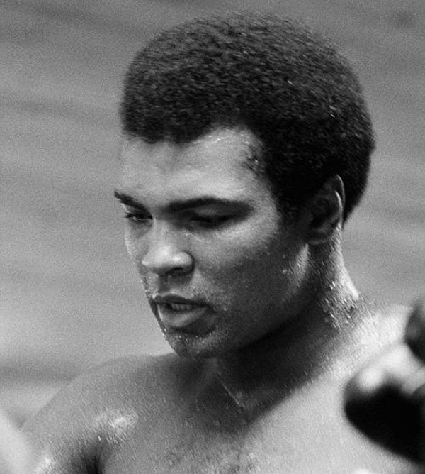 Rare black and white photo of Muhammad Ali training in a boxing ring.