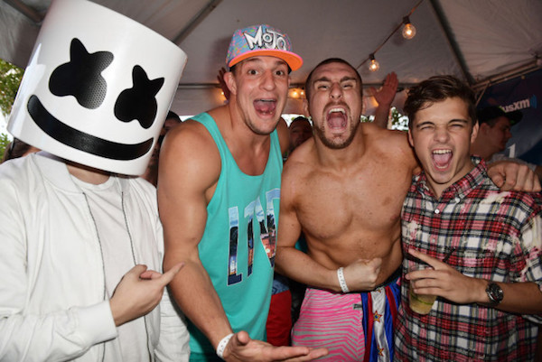 A group of people, including Gronk, posing for a photo at a Spring Break party in Miami.