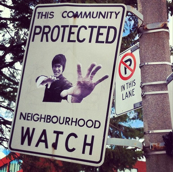 This Canadian man vandalizes a community protected neighborhood watch sign.