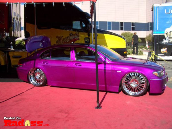 A purple BMW making a grand entrance on a red carpet.