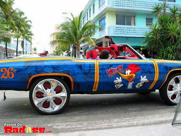 A vibrant car with a cartoon character design in blue and yellow.