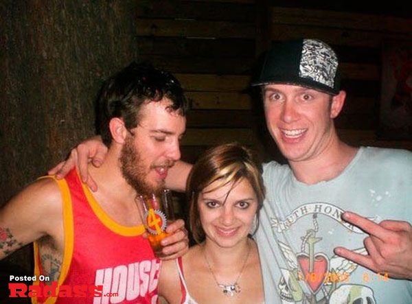 Three people posing for a picture at a party.