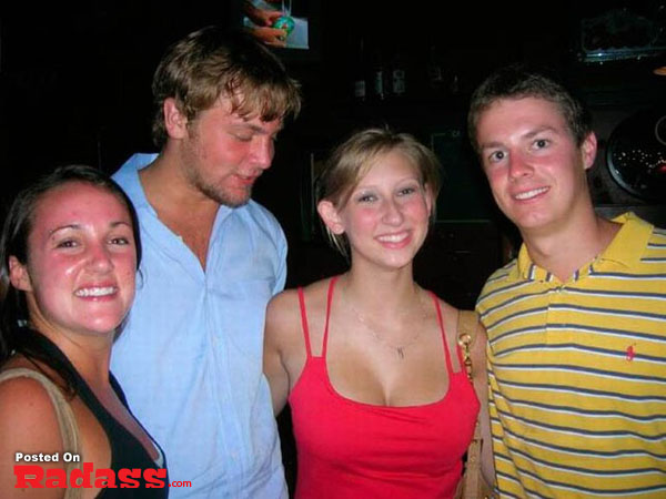 A group of people posing for a picture at a popular bar.