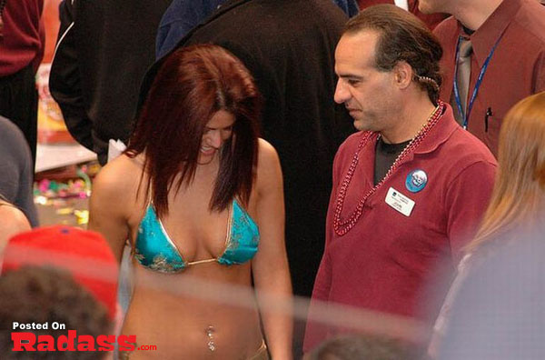 A woman in a blue bikini standing next to a man, did you see that?