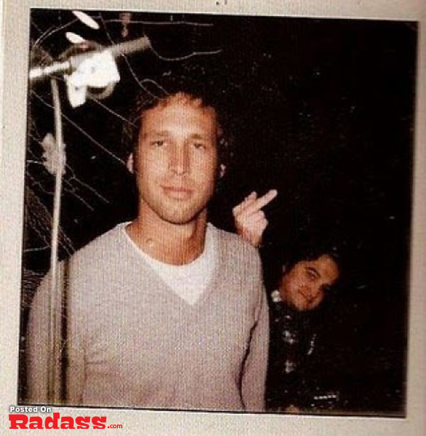 A photo of a man and a woman photobombing in front of a camera.