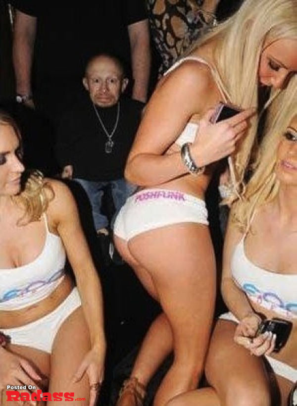 A group of women in bikinis photobombing each other at a party.