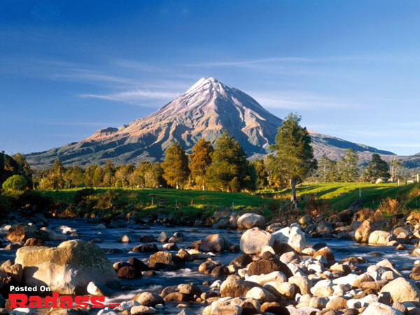 A serene mountain with a tranquil river in the background, offering an escape from civilization.
