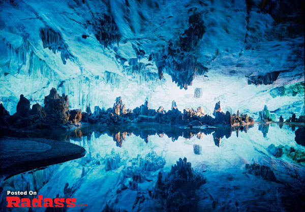 A serene image capturing an ethereal blue cave tucked away from civilization.