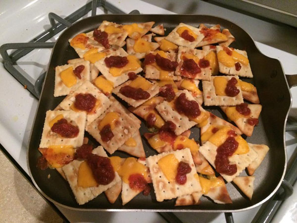 A stove-top arrangement of cheese and crackers, essential for college students' survival.