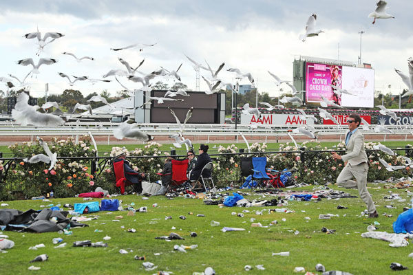 Melbourne Cup 2016 Finishes with Festive Crowd Circulating on Race Track.