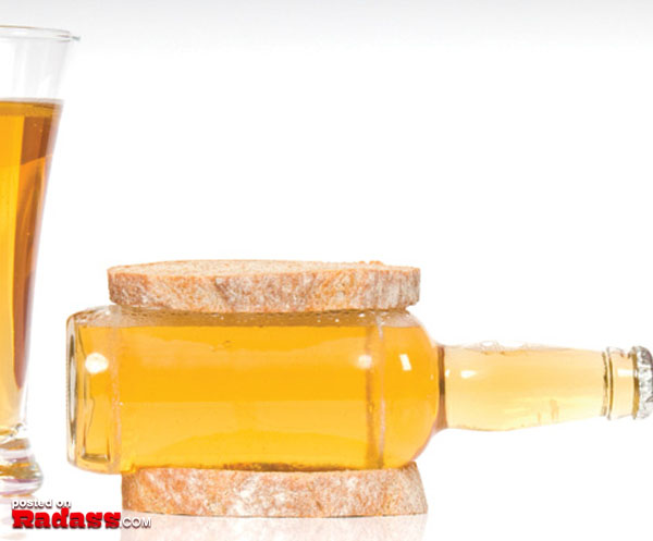 A glass of 25 beer party fouls next to a slice of bread.