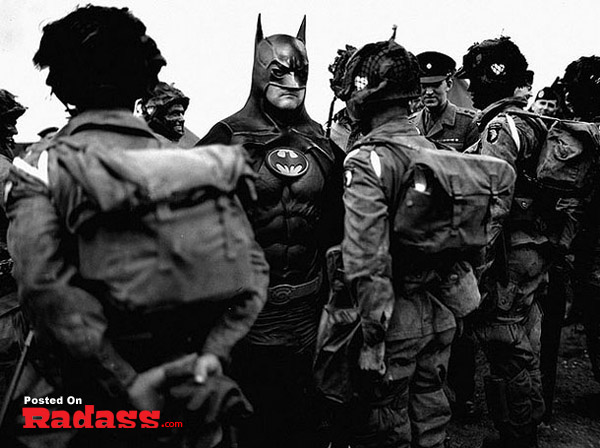 A black and white photo featuring soldiers alongside Batman, showcasing superheroes throughout history.