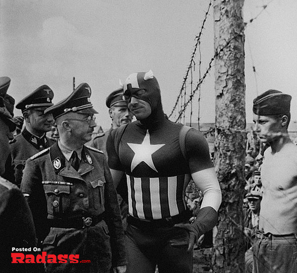A man in a military uniform is standing next to a barbed wire fence, showcasing Super Heroes Throughout History [12 PICS].
