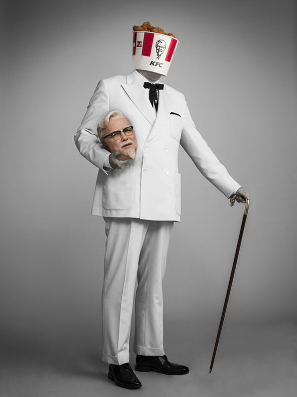 The New Colonel Sanders, donning a white suit and wielding a cane, appears photoshopped.