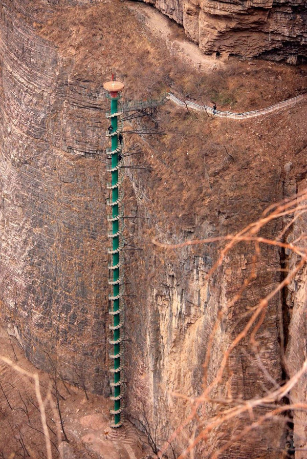A ladder is sitting atop a cliff.