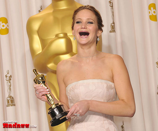 Jennifer Lawrence holding an Oscar.