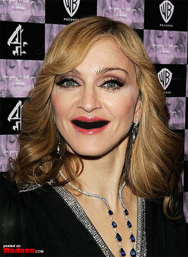 Madonna flaunting a black dress at a red carpet event.