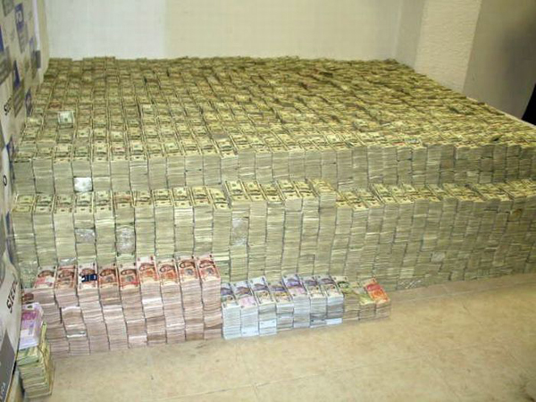 The aftermath of a raid on the home of a Mexican drug lord reveals a massive heap of money strewn across the floor.