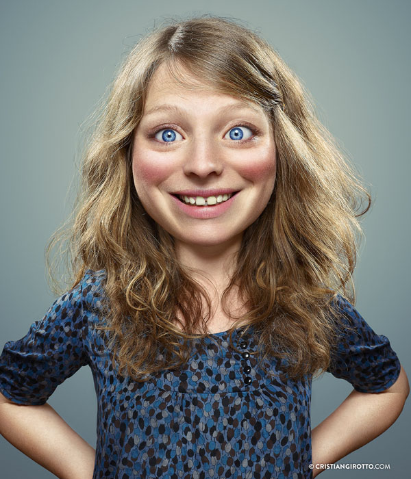 A girl with captivating big blue eyes poses for a stunning photo enhanced by Cristian Girotto's Photoshop skills.