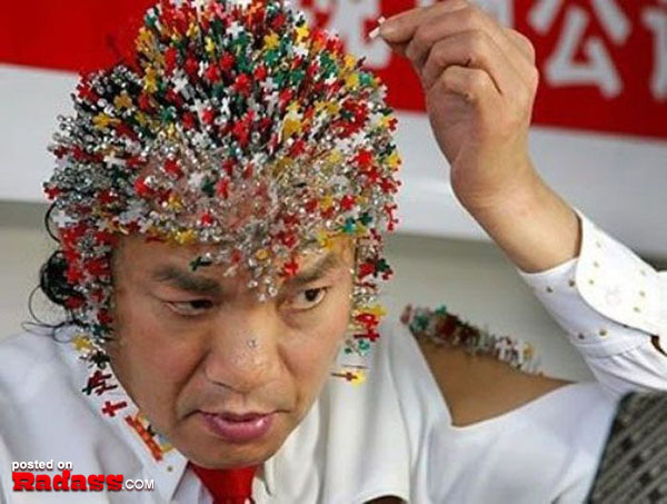 A man with a bizarre hat adorned with pins on his head amazes in this WTF Japan collection.