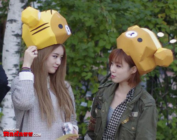 Two WTF Japan girls wearing paper teddy bear hats.