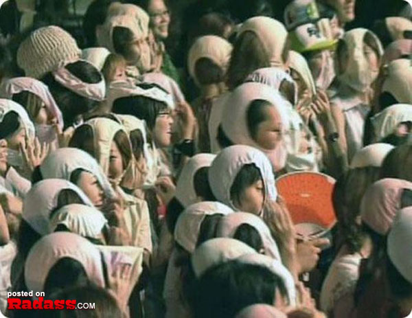 A crowd of people wearing WTF Japan hats.