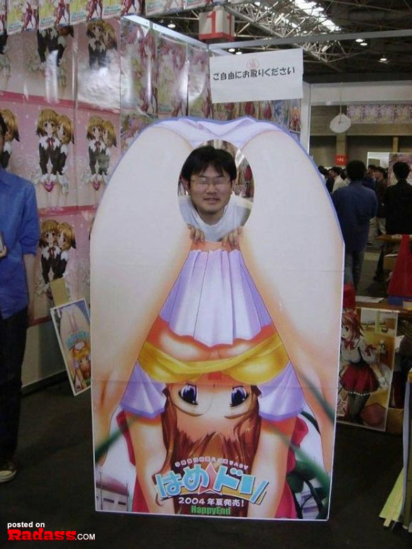 A man posing with a WTF Japan-themed cardboard cutout.