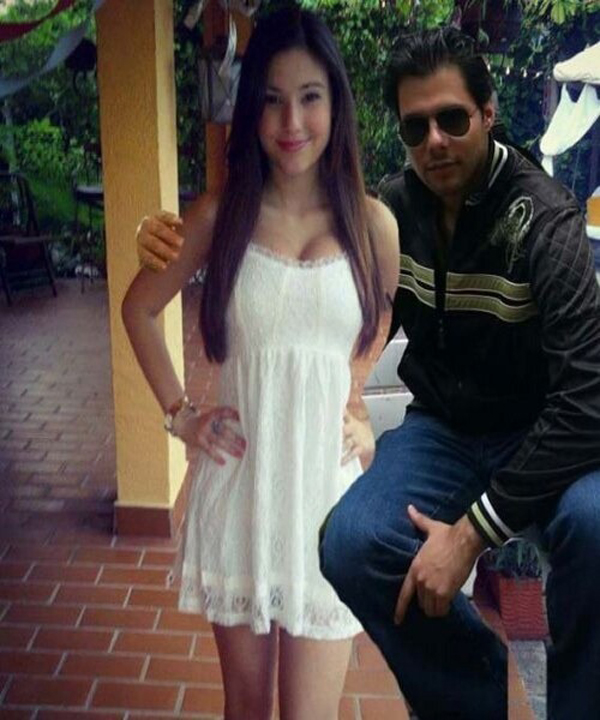 A woman posing for a picture with the guy known for his killer Photoshop skills.