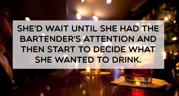 She waited until she had the bartender's attention and then started to decide what she wanted.