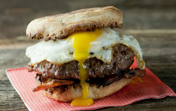 An awesome burger idea for 2022 featuring a delectable egg topping.