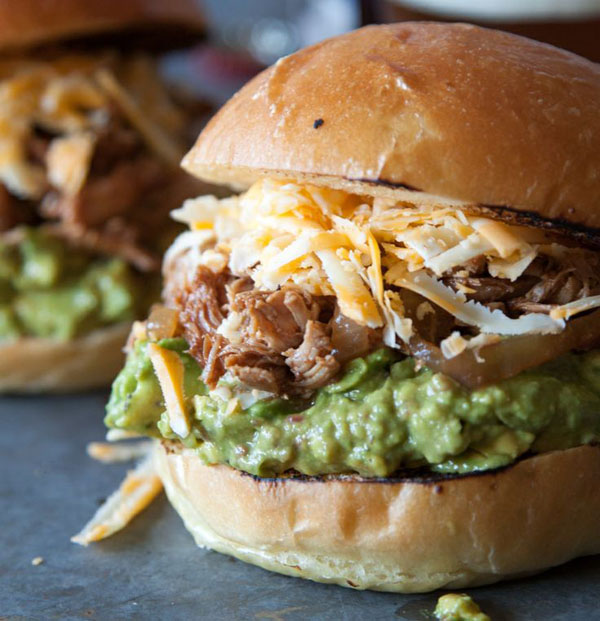 Pulled pork sliders featuring guacamole and cheese, perfect for Awesome Burger Ideas in 2022.