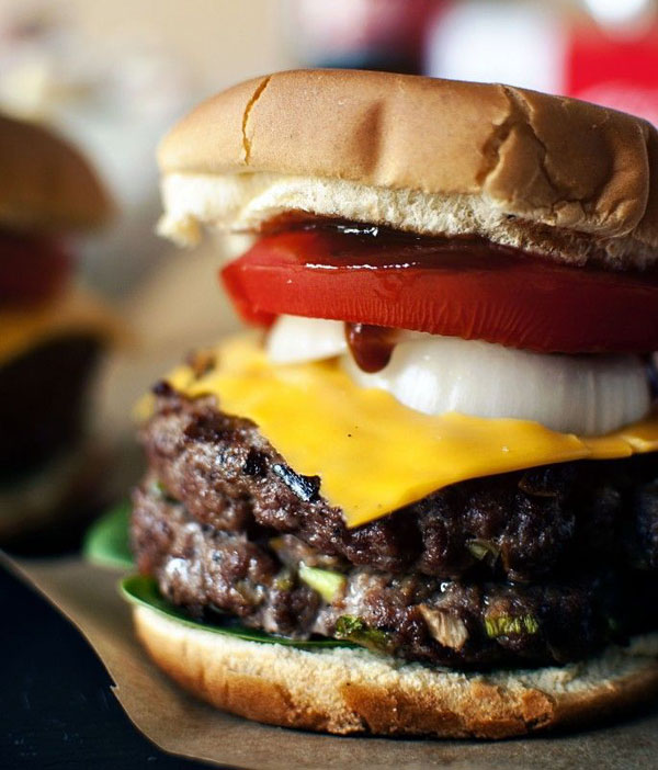 Awesome burger ideas featuring two juicy patties on a piece of paper.