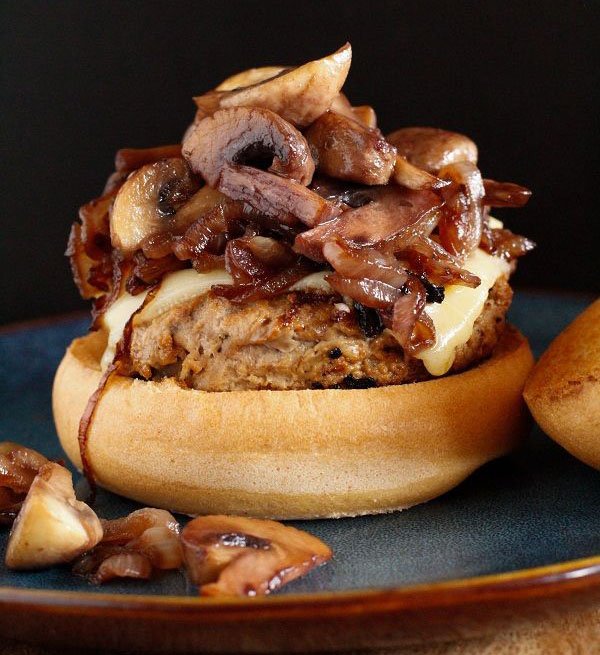 An incredible burger featuring mushrooms and cheese, perfect for 2022 cuisine trends.