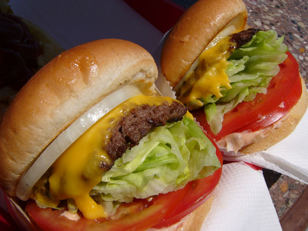 Awesome burger ideas for 2022 featuring delicious lettuce, tomatoes, and cheese.