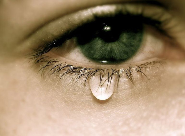A close up of a woman's eye with a tear drop in this collection of 40 Cool Pics Just To Make Your Day.