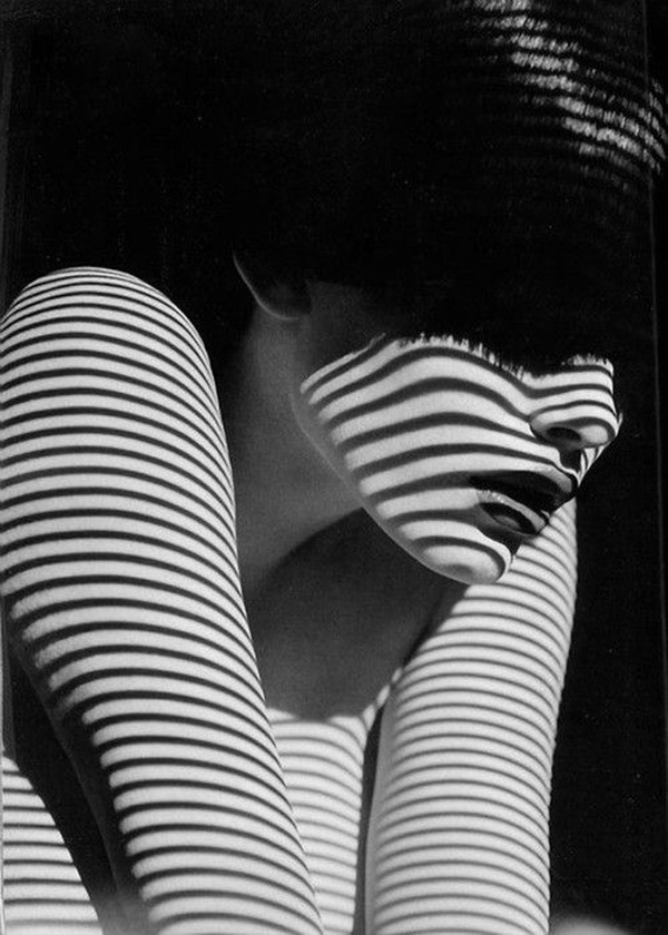 A black and white photo of a woman with striped skin, creating one of 40 cool pics just to make your day.
