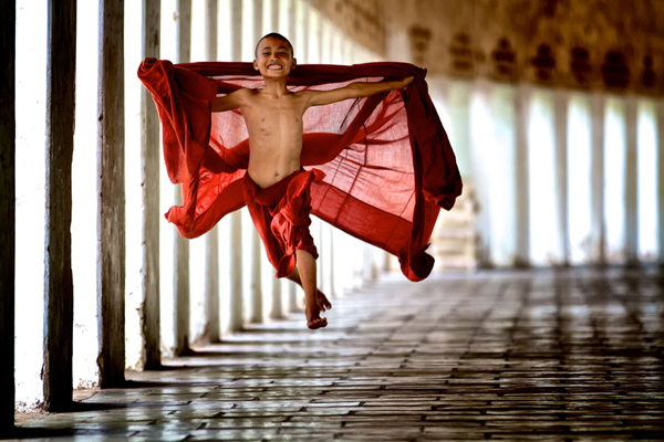 Young monk jumps in red robe, Saturday pics.