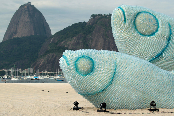 Two plastic fish sculptures on a beach, plenty of cool pics.