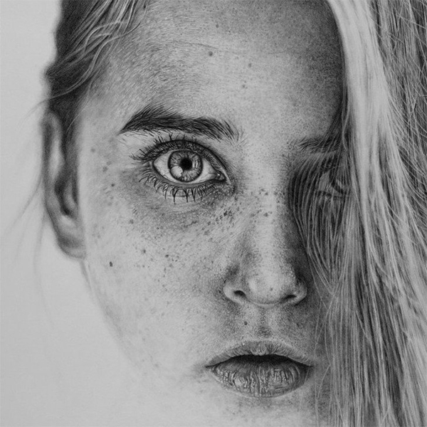 A black and white drawing of a girl with freckles to brighten your Saturday.