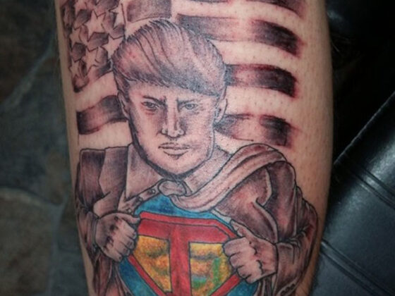 A ridiculous tattoo featuring a man with an American flag on his leg.