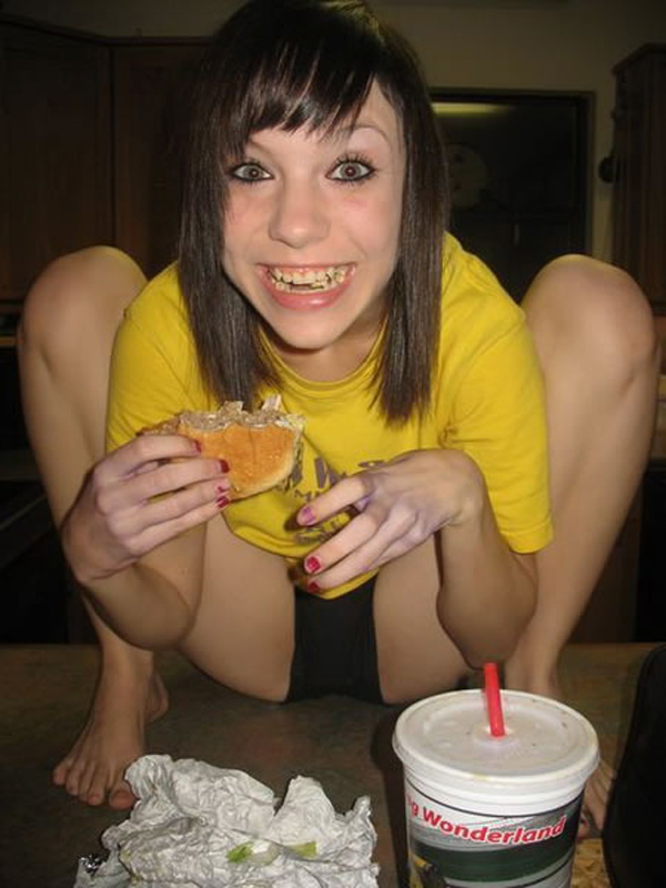 I Would Date You But... a girl in a yellow shirt eating a hot dog.