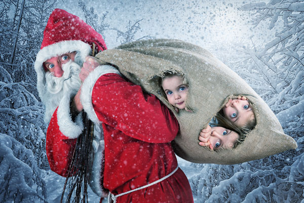 John Wilhelm Turns Everyday Photos Into Masterpieces by capturing the whimsical moments of a Santa Claus carrying a sack.