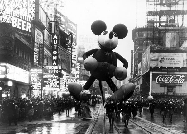 An old photo of a Mickey Mouse balloon in Times Square captured during the Macy's Day Parade.