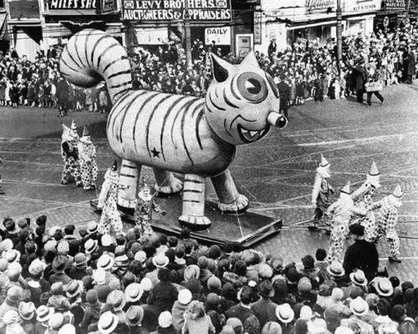 An old photo of Macy's Day Parade float with a large tiger