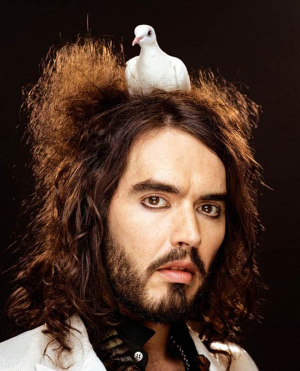 An incredible celebrity photo by Martin Schoeller featuring a man with long hair and a pigeon on his head.