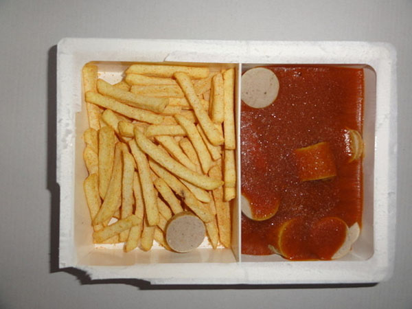 One of the 19 meals every college student knows well, featuring a tray with a hot dog and fries.