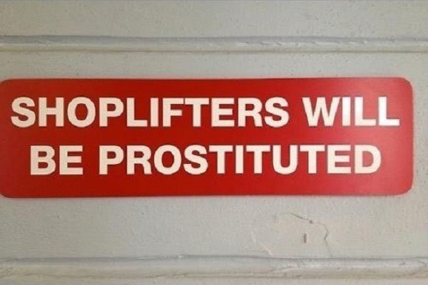 A sign warning potential shoplifters about the consequences of their actions.