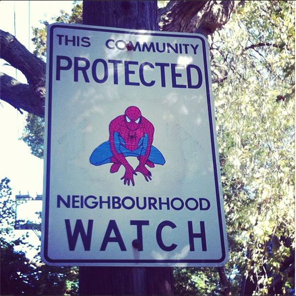 A Canadian man vandalizes neighborhood watch signs on poles.