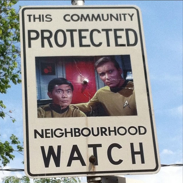 A Canadian man vandalizes a neighborhood watch sign.